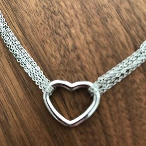 Silver multi strand heart necklace.